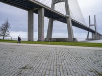 the walkway is made out of concrete and has a walkway on one side, with walkway at the other