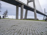 the walkway is made out of concrete and has a walkway on one side, with walkway at the other