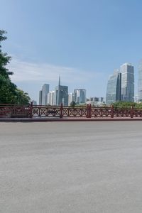 the view from the bridge of the city skylines and tall buildings are in the distance