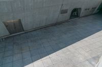 a floor made up from cement with doors in it to open and empty parking spaces to the outside