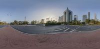 the city is shown on a circular mirror frame in this photo taken by a fisheye lens