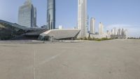 a skateboarder on the street near a group of tall buildings in china's xihan financial district