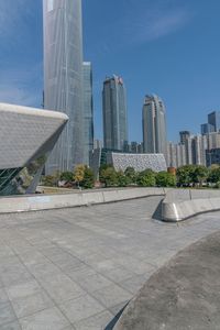 large building with two tall buildings sitting next to each other, in front of some buildings