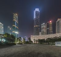 an industrial city with skyscrapers at night in china's central business district,