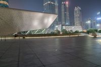 the view looking towards the glassy architecture of an asian building with a large fountain near it