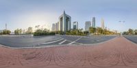 a circular panorama of the road and buildings in a city center with a yellow fire hydrant