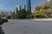 the curved road is in front of some high buildings in a city area with no people