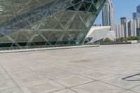 a skateboarder is riding his board in front of the new museum of art