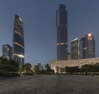 the large buildings of the city are lighted up by street lamps in china's financial district