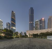 the large buildings of the city are lighted up by street lamps in china's financial district