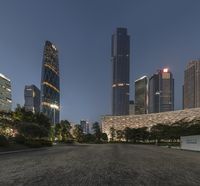 the large buildings of the city are lighted up by street lamps in china's financial district