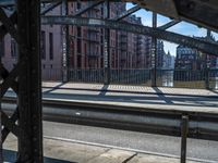 this is a view from inside a train platform looking through the window into a city