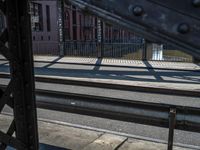 this is a view from inside a train platform looking through the window into a city