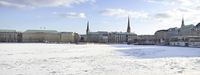 an open swimming field filled with water and people standing in the ice looking out at it