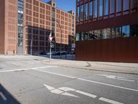 a large building sitting next to a tall red brick building with glass windows is shown