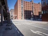 a large building sitting next to a tall red brick building with glass windows is shown