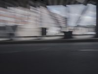 an image of a blurry picture of the road below them in motion on a cellphone