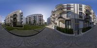 a 360 - view shows some buildings on this street in the city's suburbs