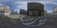 this is a 360 - shot of the street of a city on an overcast day