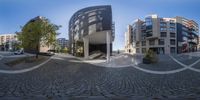 the 360 - fisheye lens photo shows people's reflection on the building exterior