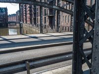 a view of the inside of an old city bridge from an empty train track,