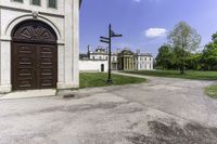 a large house with a brown door and a brown fenced entrance to it from the back