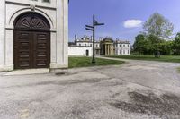 a large house with a brown door and a brown fenced entrance to it from the back