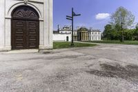 a large house with a brown door and a brown fenced entrance to it from the back