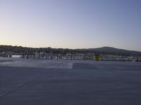 the large crane is overtaking the parking lot at the harborfront park area, which has been closed since