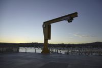 the large crane is overtaking the parking lot at the harborfront park area, which has been closed since