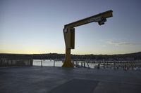 the large crane is overtaking the parking lot at the harborfront park area, which has been closed since