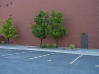 a paved street has been painted light gray, with gray brick walls and concrete edges