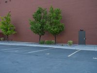 a paved street has been painted light gray, with gray brick walls and concrete edges