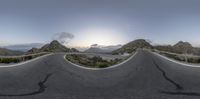 3d image of a wide mountain road with curves of concrete going over the mountain tops