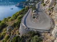 High Curve Road in Mallorca under Clear Sky and Ocean