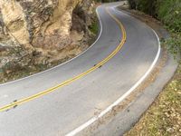 High Mountain Road through Rural Landscape