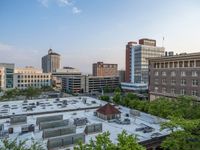 several large empty parking spaces in the city with buildings nearby in front of them -