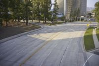 an overhead view looking down at a yellow line on a street in an empty city