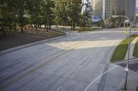 an overhead view looking down at a yellow line on a street in an empty city