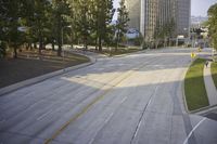 an overhead view looking down at a yellow line on a street in an empty city