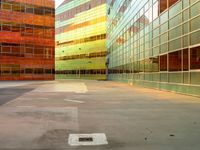 a view of many windows in a building and street in the background is bright green