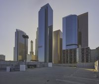 the city skyline has skyscrapers along with other tall buildings behind it for commercial use