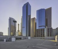the city skyline has skyscrapers along with other tall buildings behind it for commercial use