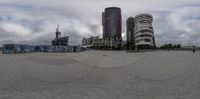 three high - rise buildings surround the city's circular view lenses in this time lapsure