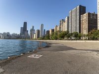 a lake in a city with high rise buildings and a no parking sign posted on it