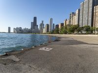 a lake in a city with high rise buildings and a no parking sign posted on it