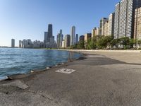 a lake in a city with high rise buildings and a no parking sign posted on it