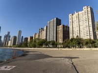 a lake in a city with high rise buildings and a no parking sign posted on it