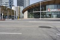 there is an intersection on the street that's blocked off by two arrows, which appear to be pointing the same direction