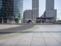 the city has two buildings and a sign in the street that warns people not to turn